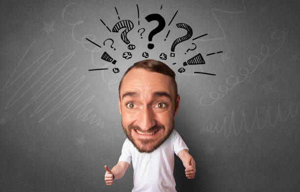istock Big head on small body with blackboard and white chalk drawn on the background 1158191563