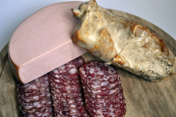 istock meat and sausages on wooden background 1158191864