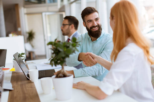 istock Business people shaking hands in office 1158192507