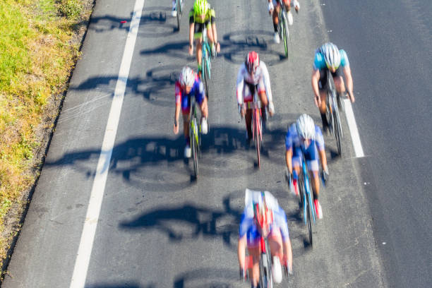 The cyclists riding by at the bicycle race Around Denmark 2006.