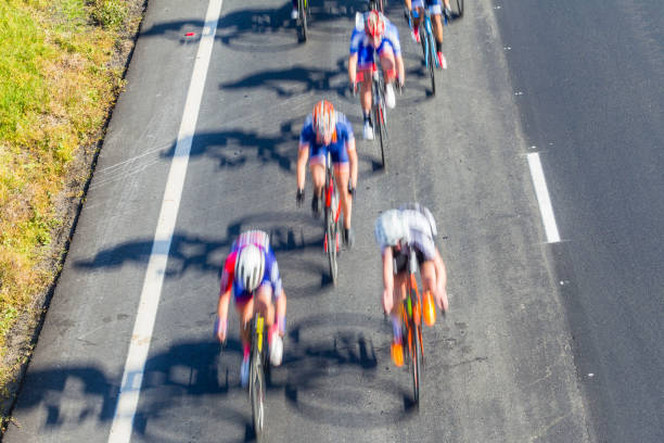 istock Road Race Cycling Cyclists Motion Blur Overhead 1158193032