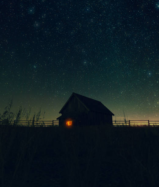 Scene of old barn at night stock photo