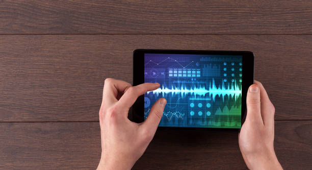istock Hand holding tablet with sound design concept 1158194349