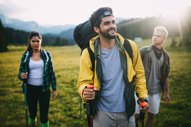 istock Successful Group of Happy Friends on Mountain Top, Cheering 1158194503