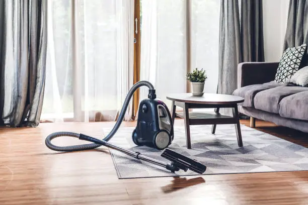 Photo of Vacuum cleaner in living room at home