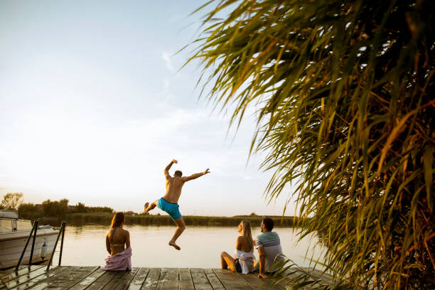 istock Young people having fun at the lake on a summer day 1158198850