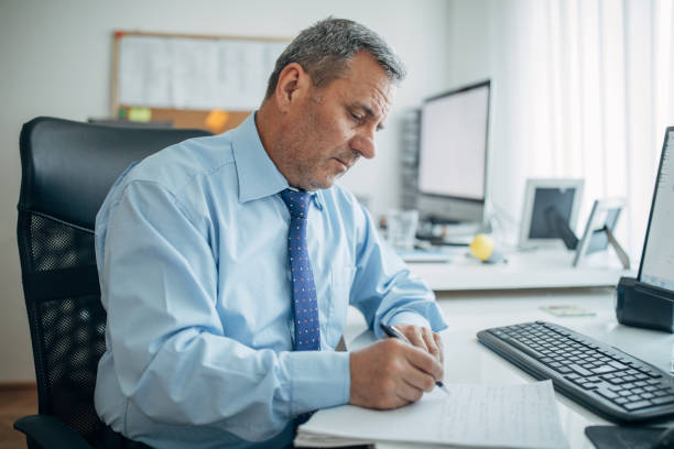 istock Senior businessman at the office 1158202036