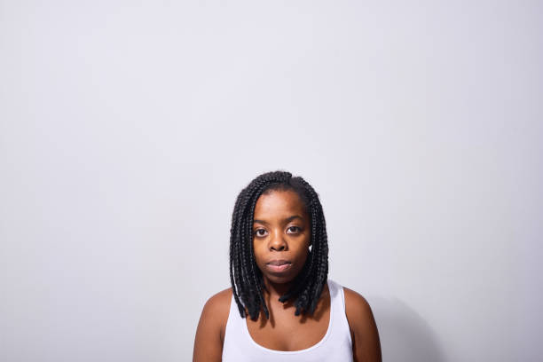 istock Serious black woman looking at camera 1158202211
