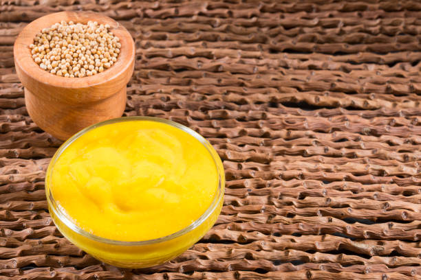 istock Mustard with seeds on the wooden background. 1158205938