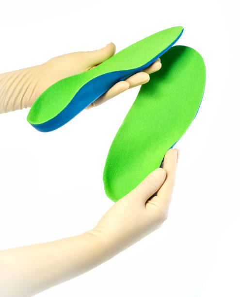 istock Female orthopedist with insole 1158206495