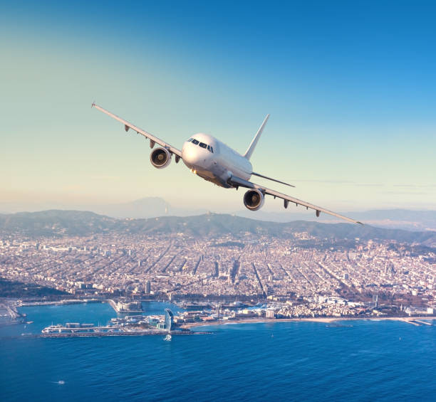 istock flying above Barcelona city 1158206514
