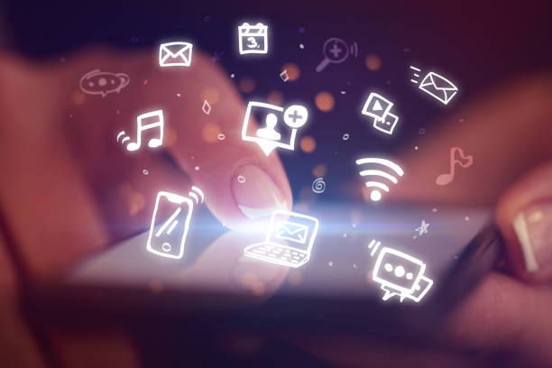 istock Finger touching phone with hologram app icons above 1158206730