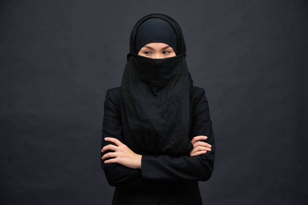 istock Mysterious ethnic woman covered with hijab 1158207324