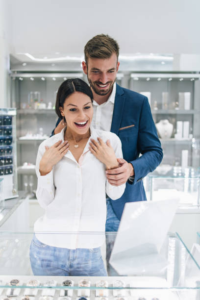istock Attractive middle age couple in jewelry store 1158207549