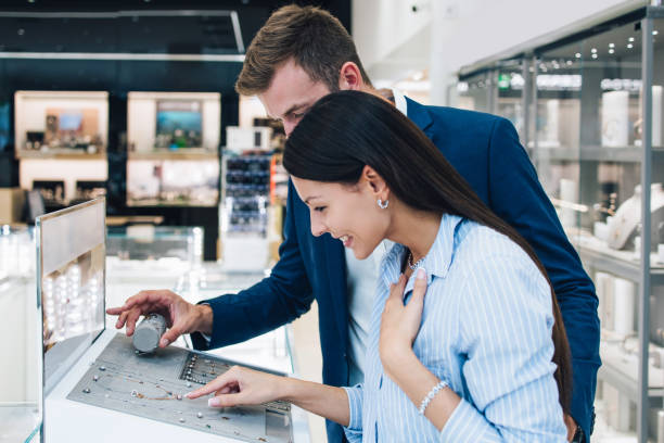 istock Attractive middle age couple in jewelry store 1158207631