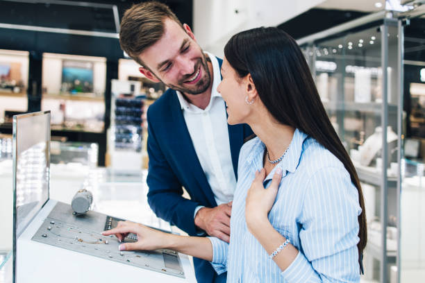 istock Attractive middle age couple in jewelry store 1158207672