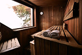 Location of a mountain wood sauna with a large window in which to relax.