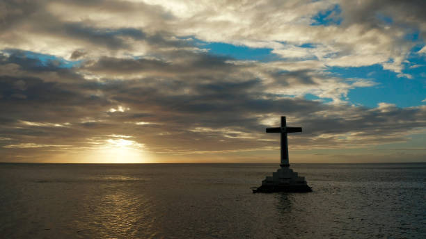 istock Sunken Cemetery cross in Camiguin island, Philippines 1158209325