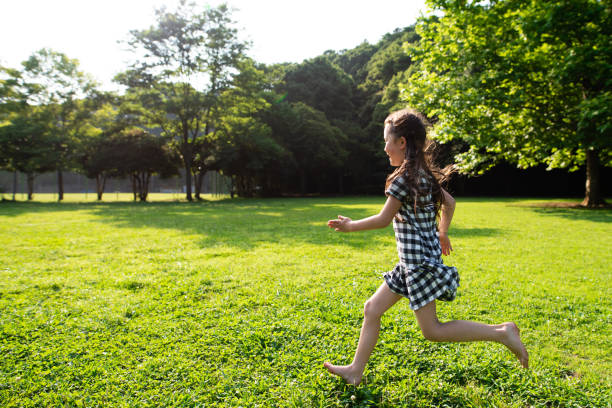 istock Girl playing barefoot 1158211844