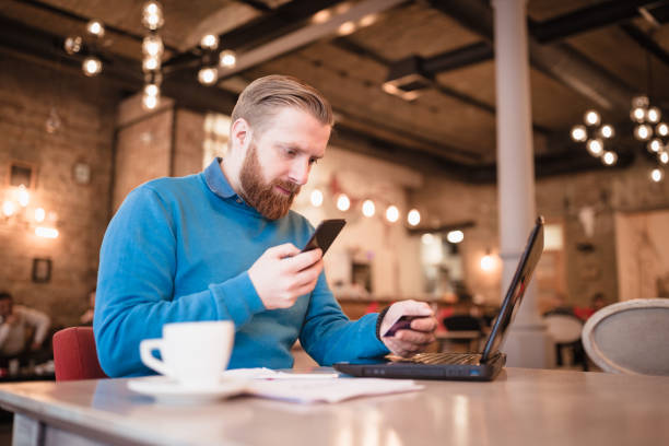 istock Redhead businessman, making online purchase with credit card 1158213892