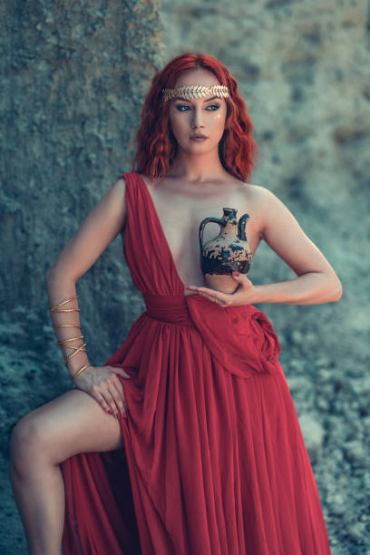 istock Beautiful Elegant Female With A Water Pitcher Standing Near Rocks 1158214962