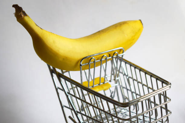 istock shopping cart only with a banana 1158216582