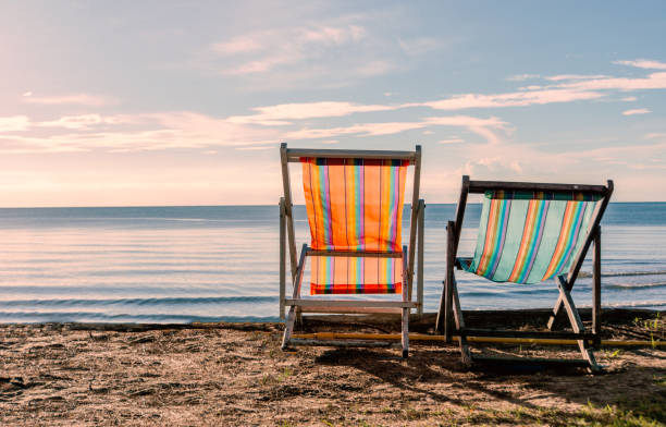 istock Beach at the morning with two beach chairs 1158217135