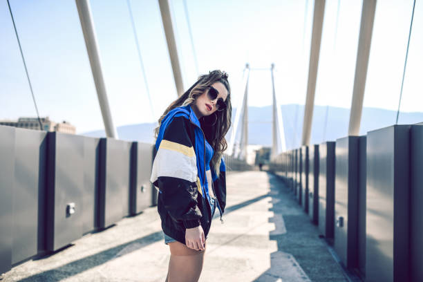 istock Urban Female Walking On Modern Bridge 1158221576