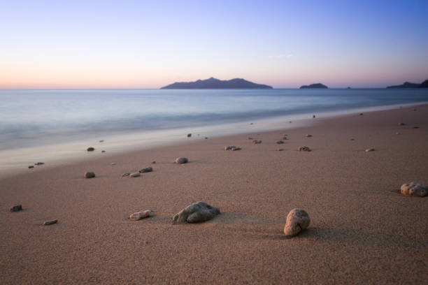 Mayotte White Sand Beach at Sunset Beautiful white sand beach of Mayotte at sunset mayotte stock pictures, royalty-free photos & images