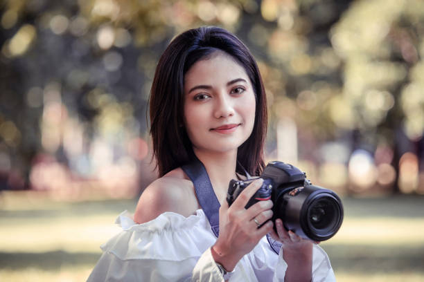 istock One women in Public park drink coffee and read a book 1158225537