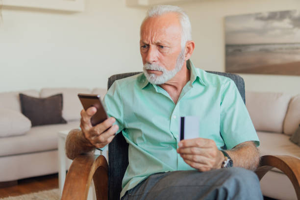 istock Serious man looking at phone 1158226597