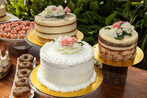 istock Cakes, table with three different cakes decorated for the reception of the wedding 1158227226