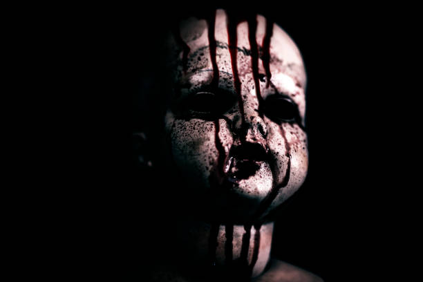 istock Creepy bloody doll in the dark 1158227441
