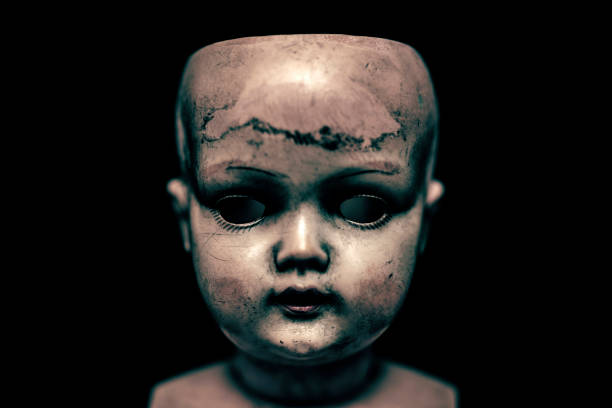 istock Creepy doll in the dark 1158227444