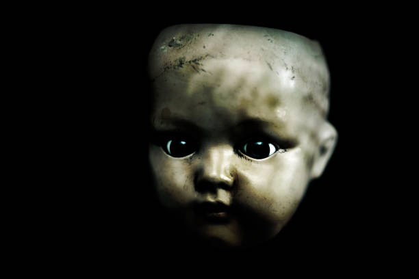 istock Creepy doll in the dark 1158229941