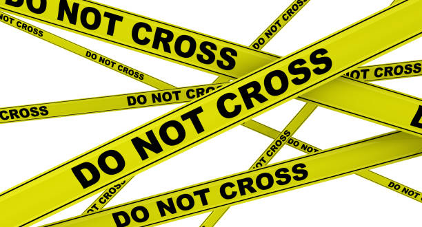 istock Do not cross. Yellow warning tapes 1158230256
