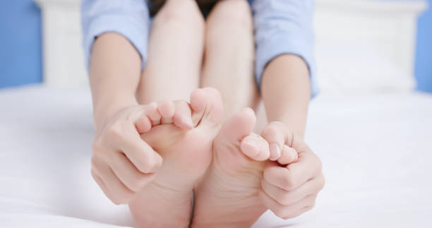 istock woman has athletes foot 1158231349