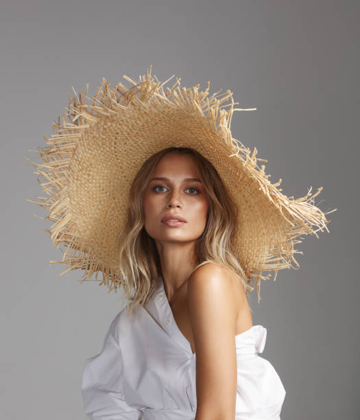 istock Beautiful woman wearing straw hat 1158231622