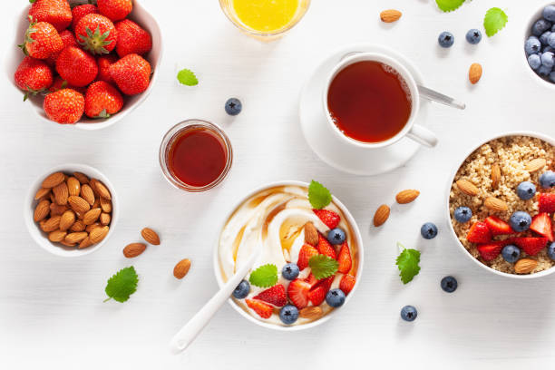 istock yogurt with strawberry blueberry honey almond and quinoa for breakfast 1158231663