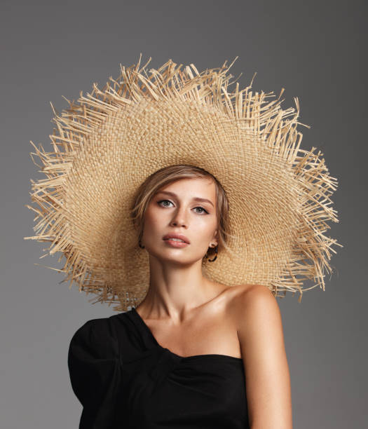 istock Beautiful woman wearing straw hat 1158231763