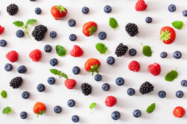 istock assorted berries over white background. blueberry, strawberry, raspberry, blackberry 1158232713