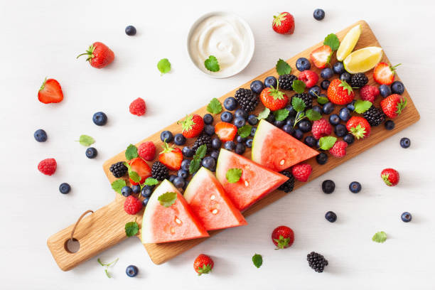 istock fruit and berry platter over white. blueberry, strawberry, raspberry, blackberry, watermelon 1158233247