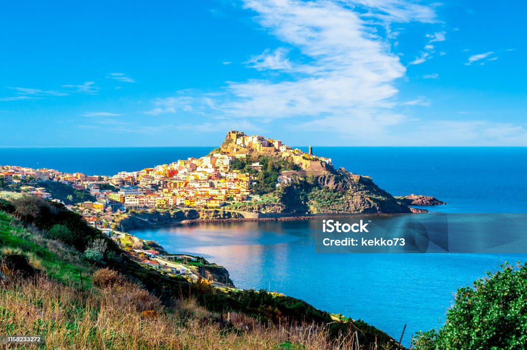 View of ancient village on the coast View of ancient village of Castelsardo - Sardinia in a cloudy day of spring Castelsardo Stock Photo