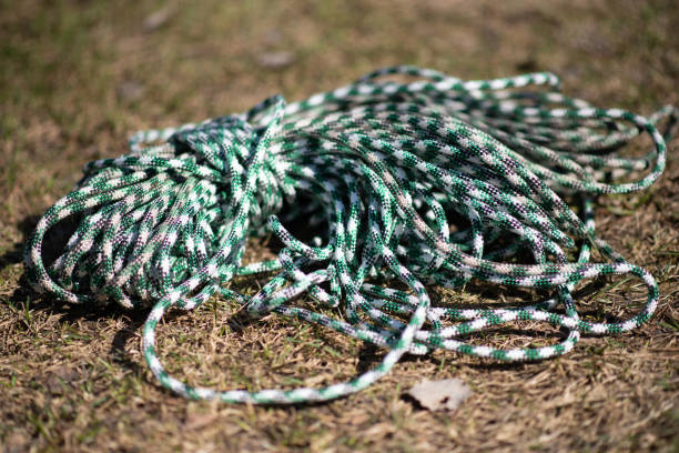 istock climbing equipment. rope lies on the grass 1158233300