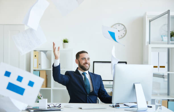 istock Carefree office employee throwing papers 1158235759