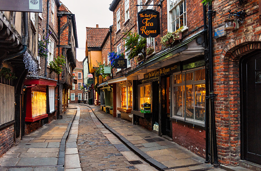 York, UK - Traditional shops on the famous and ancient narrow medieval street, the Shambles.