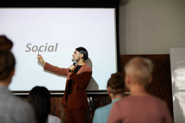 istock Young Businessman Speaking at Conference 1158237424