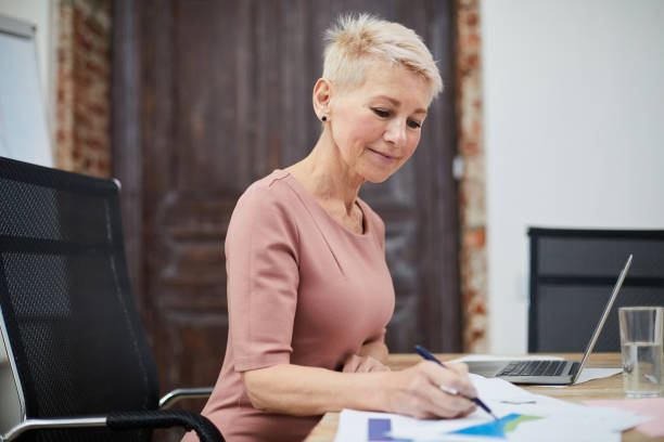 istock Mature Businesswoman Working 1158237496