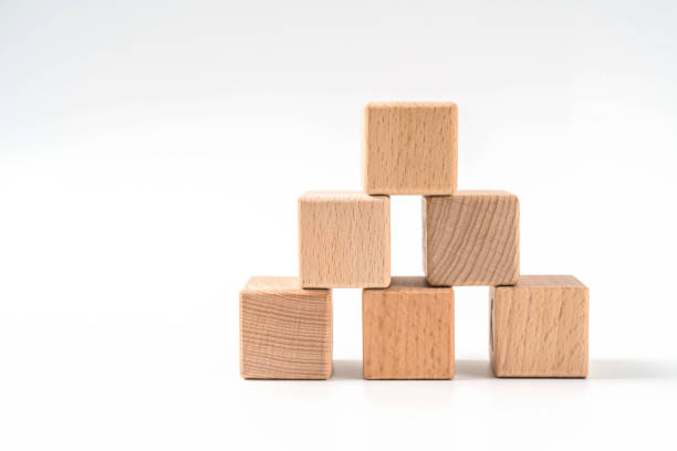 istock wood cube arrange in pyramid shape ,business concept 1158237584