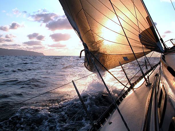 sailing to the sunrise stock photo